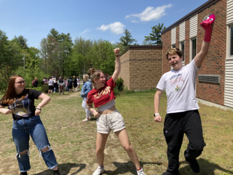 Juliana Stevens (left) Lucy Defilippo (middle) and Noah Jacobson (right) dance while listening to the karaoke that the Tri-M Music Honor Society hosted for Spring Fling.