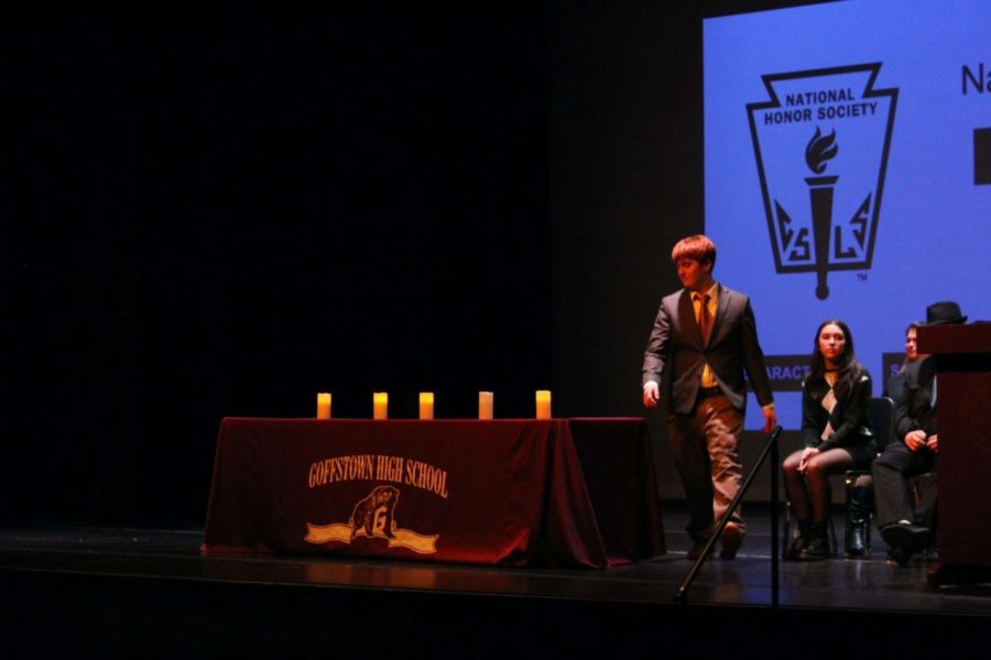 Matthew Stanton approaches podium during NHS Induction ceremony