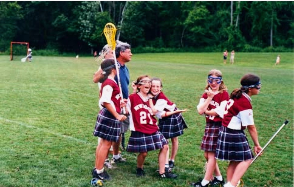 Marisa playing lacrosse first grade(#21)