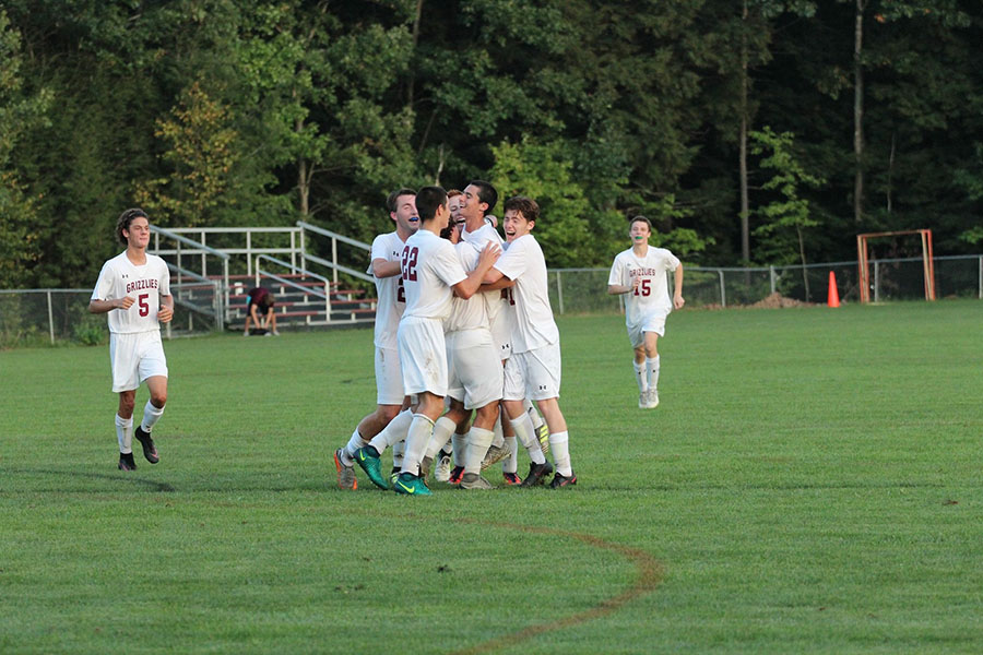 The boys have a little celebration after their 3-2 win over Lebanon.