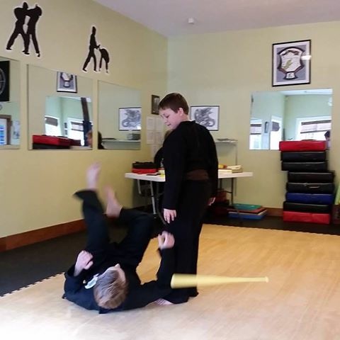 Grant (standing) when he was testing for his next belt two years ago