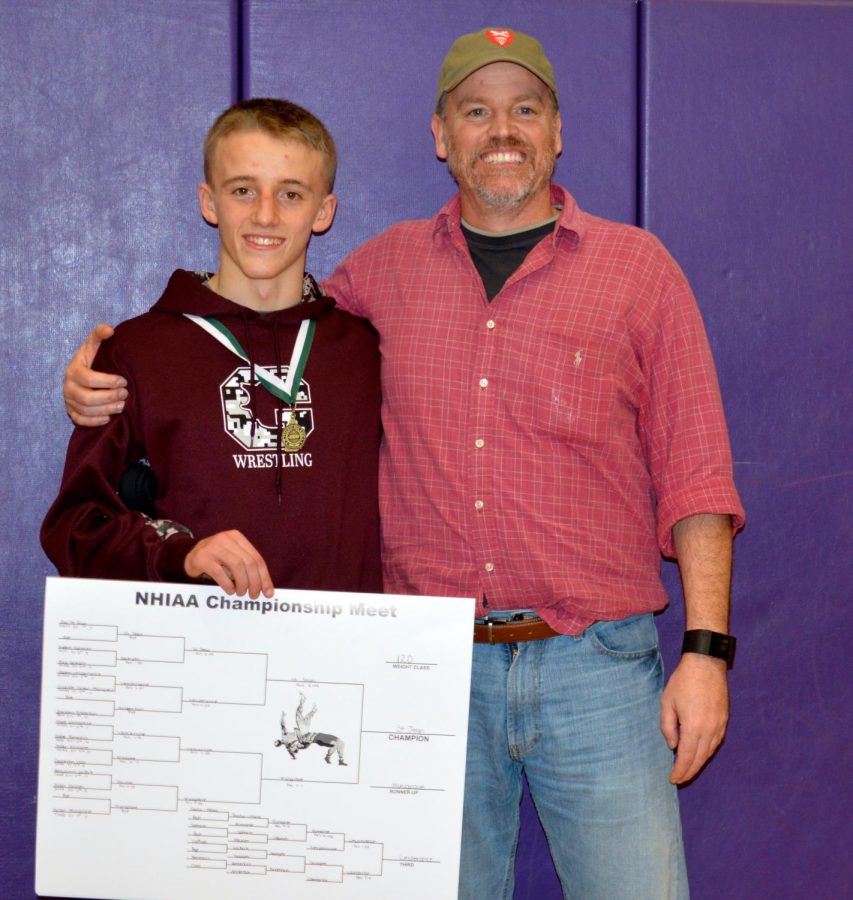Dana Dennis alongside his nephew Jac after his All-State wrestling tournament.