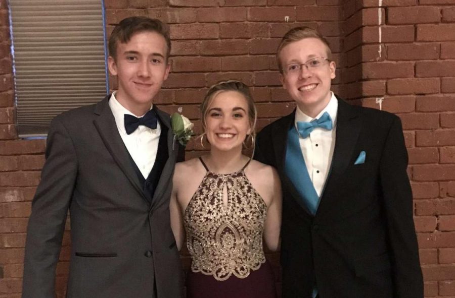 Jared Steil, Kelsey Gregorio, and Adam Zienkiewicz pictured at their junior year prom.