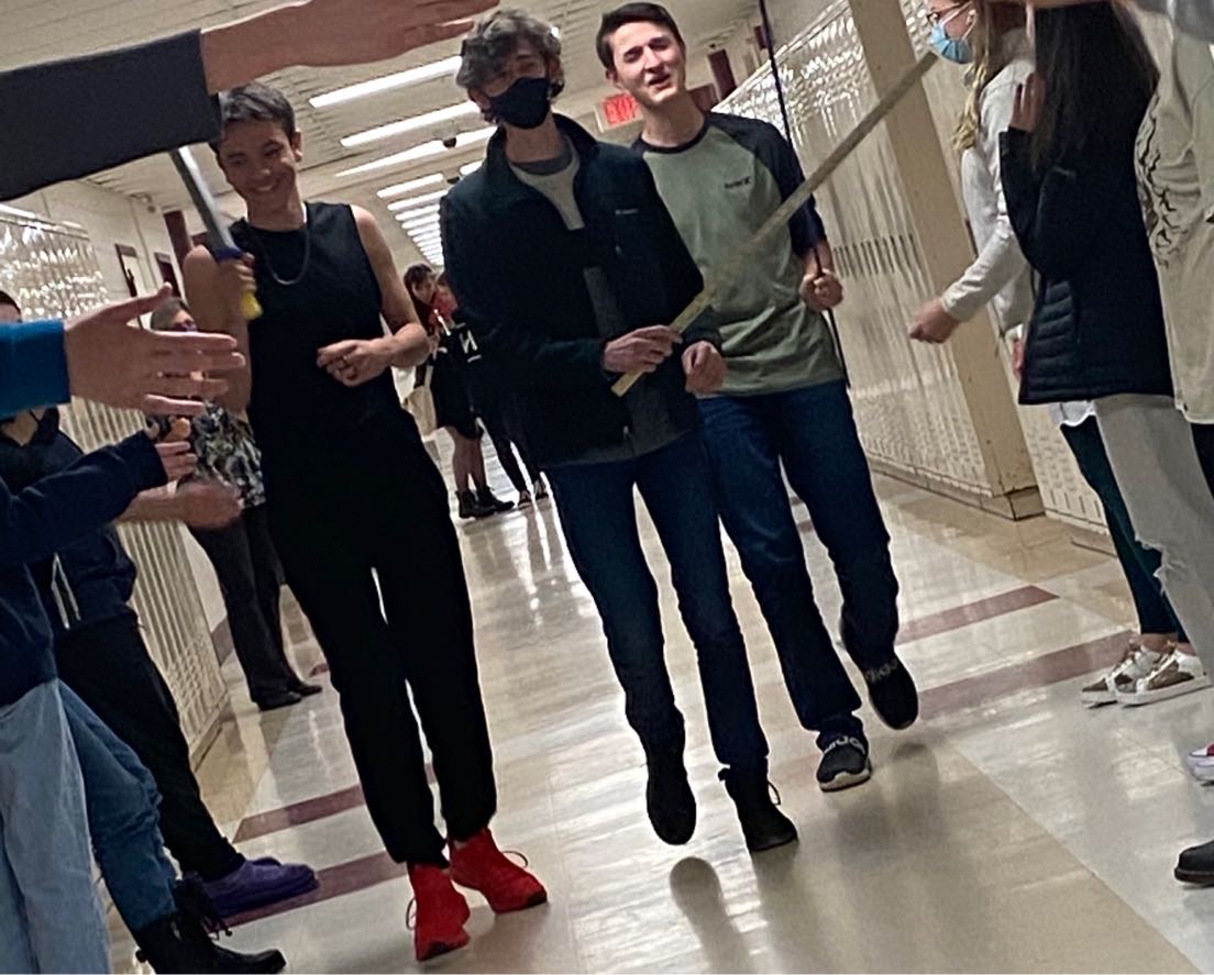 Three Latin Club members run down the hallways of Goffstown Highsc
hool, to mimic the Luperci whipping of the Roman citizens while running around the city of Rome.