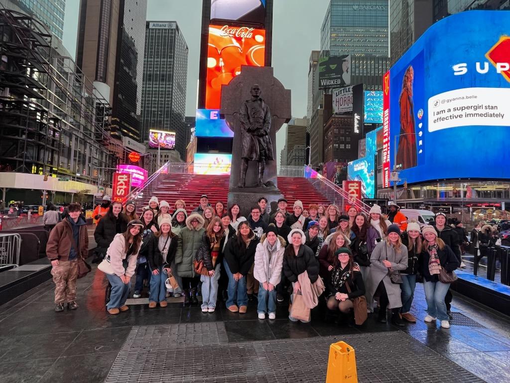Whole group picture at Times Square. 